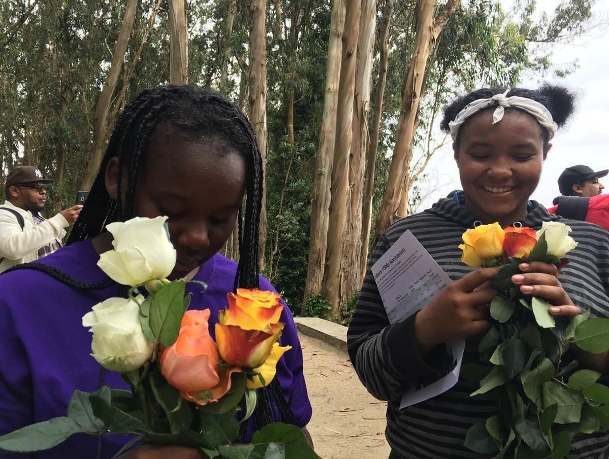 Two girls with bouquets of flowers