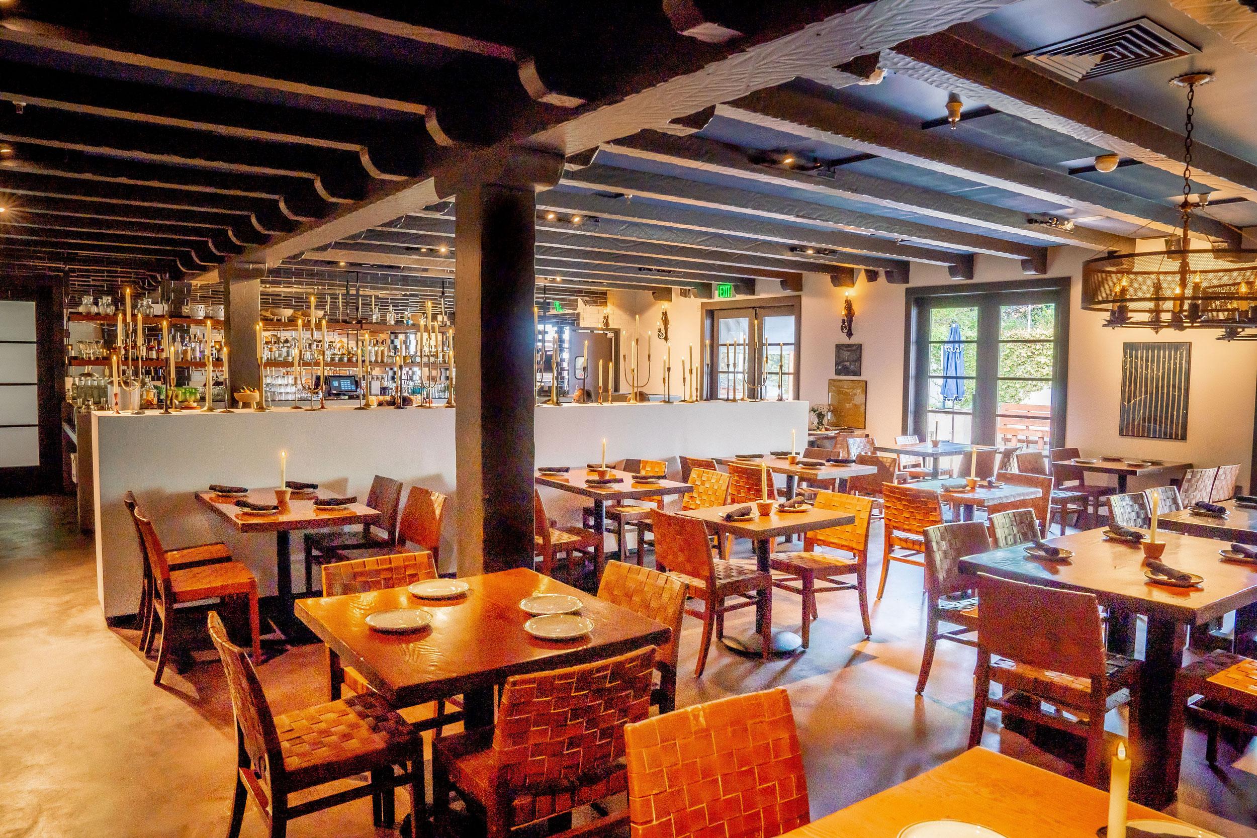 Interior dining room at Colibri with bar in the back