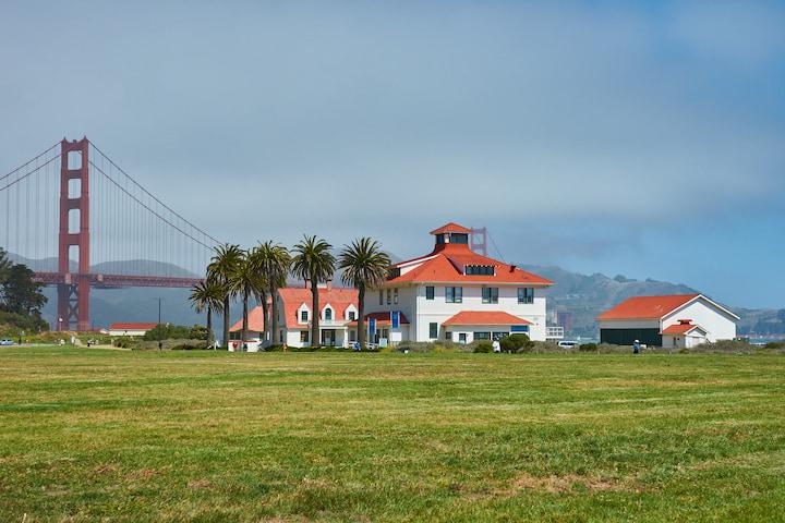 Farallones Visitor Center exterior, with the Golden Gate Bridge in the background.