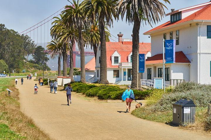 Visitors walking on the trail outside the Farallones Visitor Center.