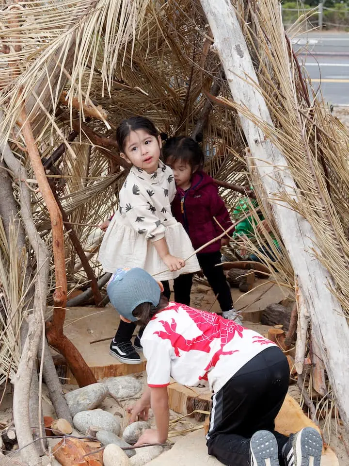 Three kids in a play structure at Presidio Tunnel Tops. Photo by Dan Friedman.