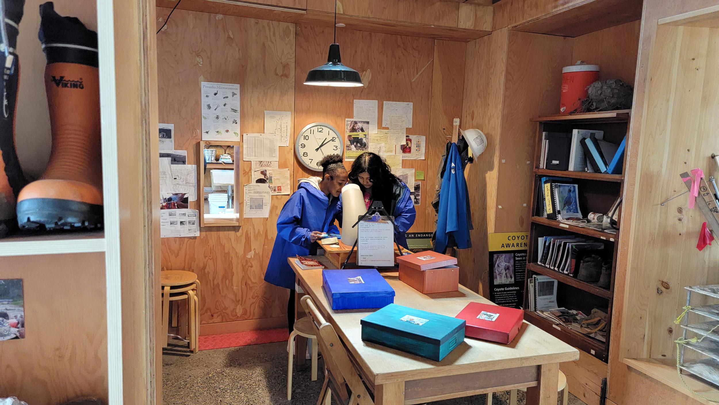 Two girls inside the Field Station.