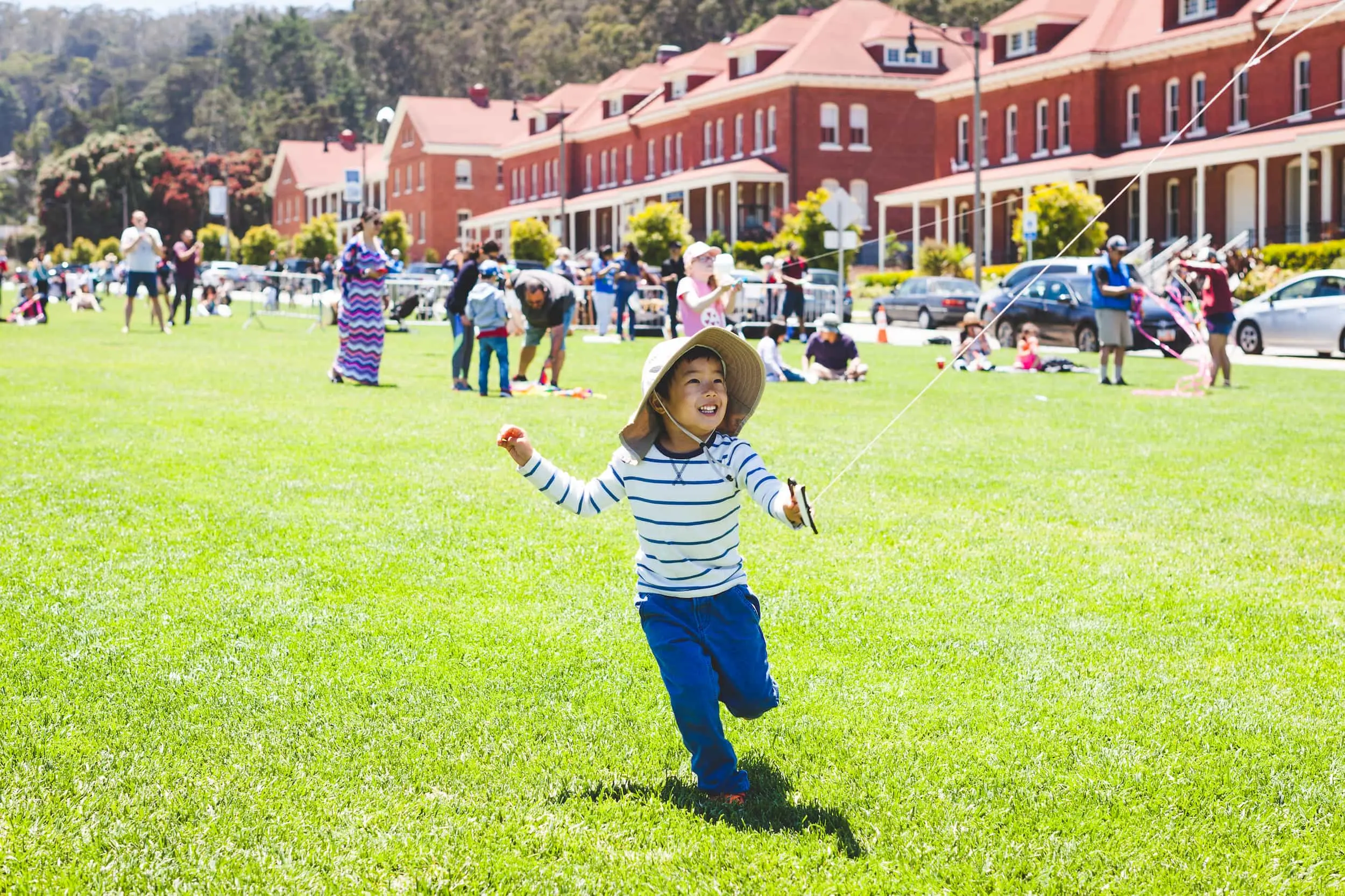 Image of a small boy flying a kite.