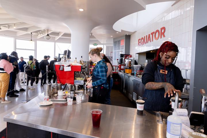 Interior of the Roundhouse Café, with a barista making Equator Coffee. Photo by Myleen Hollero.