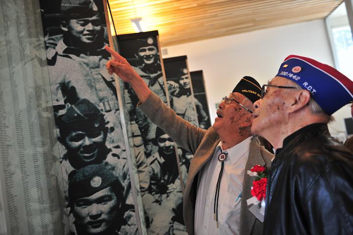 Two veterans of the learning center tour the exhibitions.