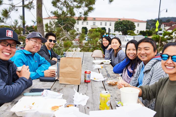 A large group enjoying a meal at Picnic at Transit.