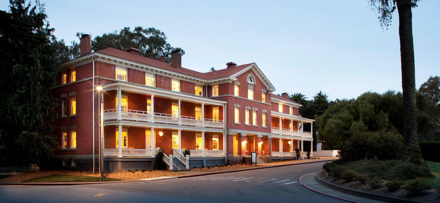 Exterior of the Inn at the Presidio at dusk.