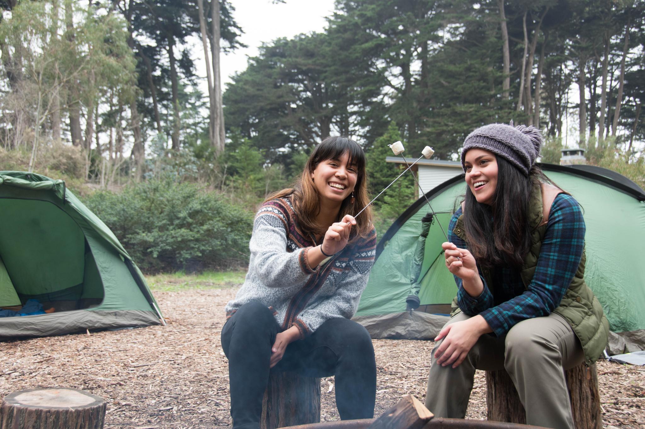 Two girls enjoying s'mores at Rob Hill Campground.