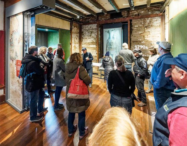 Volunteer leads a tour at the Presidio Officers’ Club. Photo by Dan Friedman.