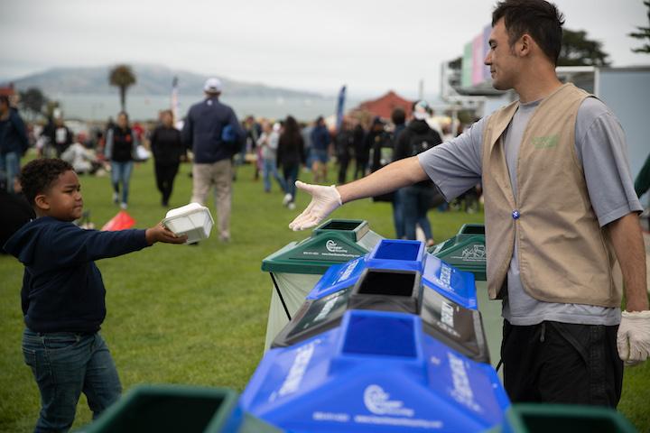 Child recycling at a Presidio event.