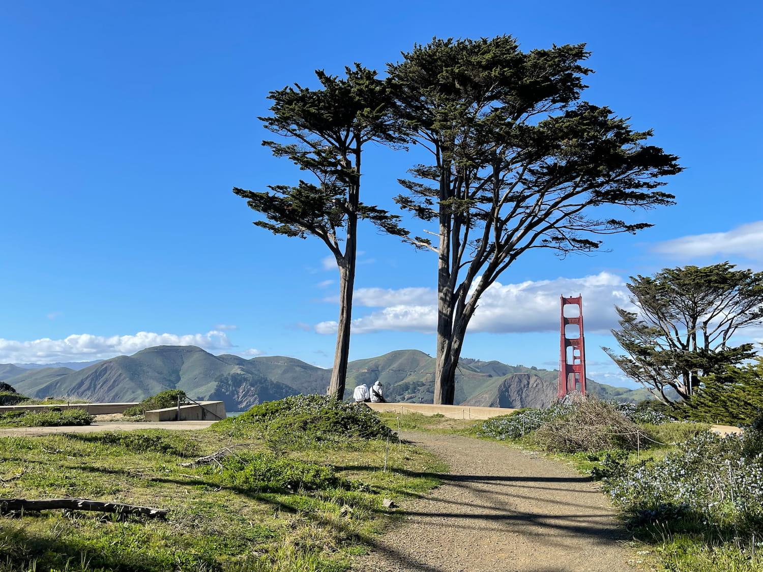 Two visitors at Golden Gate Overlook along the Juan Bautista de Anza National Historic Trail