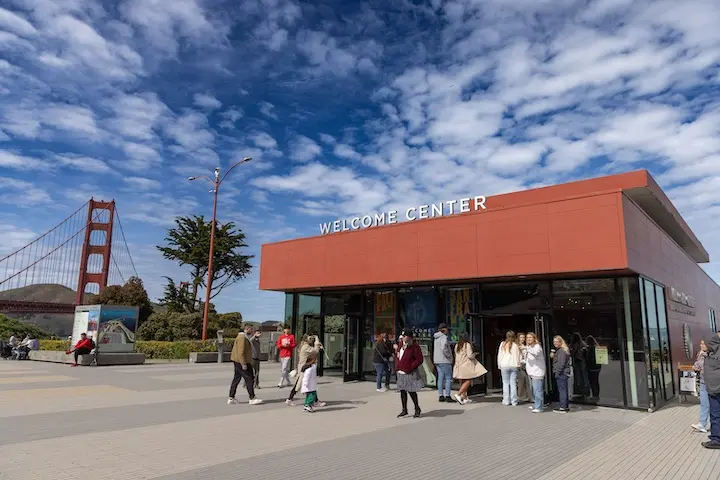 Golden Gate Bridge Welcome Center with the bridge and blue skies in the background.