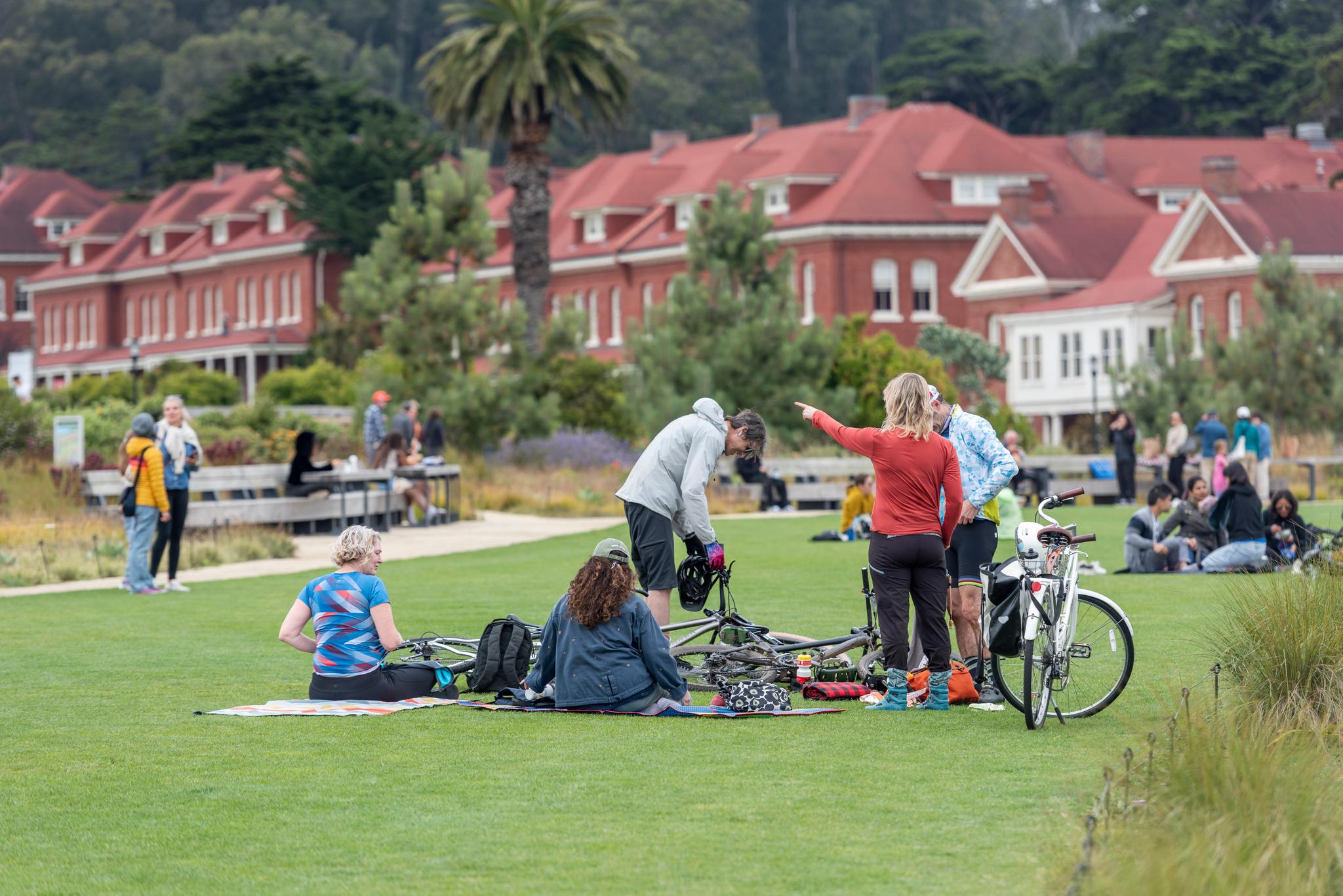 Group of people sitting with bikes on Presidio Tunnel Tops