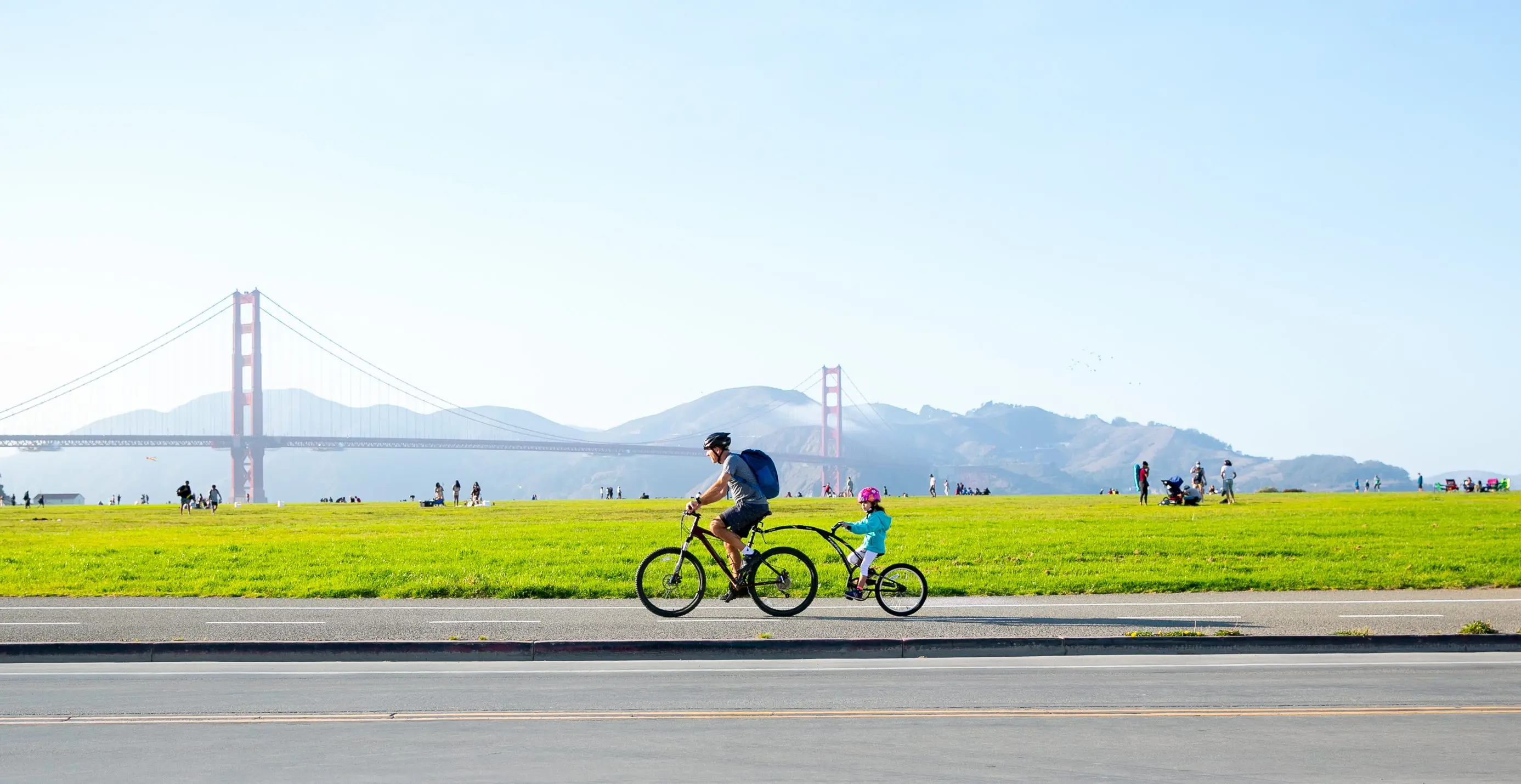 Father and child biking together along Crissy Field