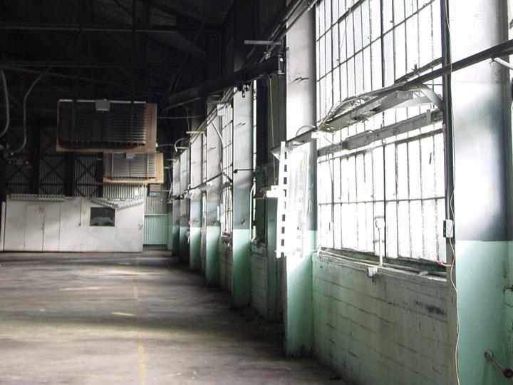 Interior and windows of an unfinished, empty Building 937.