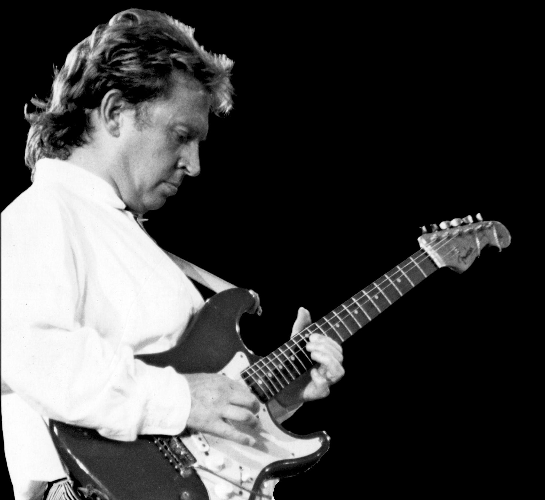 Black and white picture of Andy Summers playing guitar