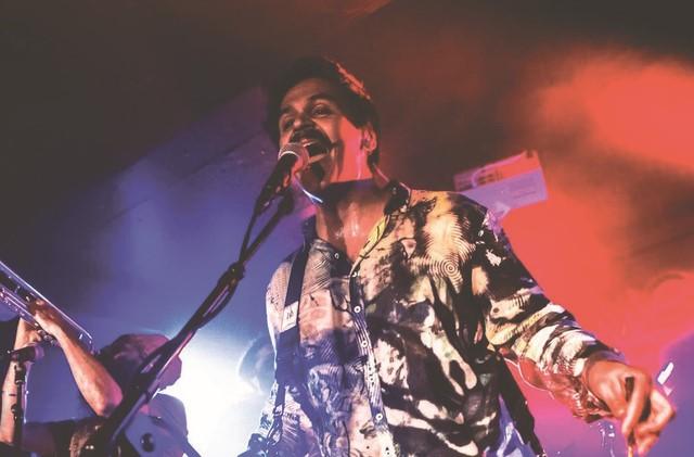 man singing into a microphone