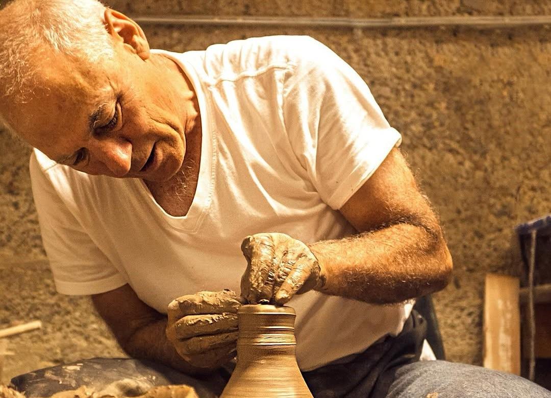 Loring Sagan creating his stoneware.