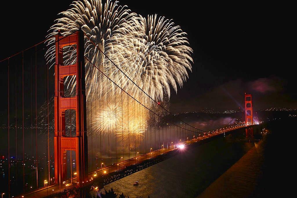 golden gate bridge looking south with fireworks over the water