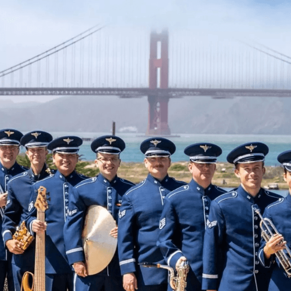 USAF Military band standing in front of the Golden Gate Bridge