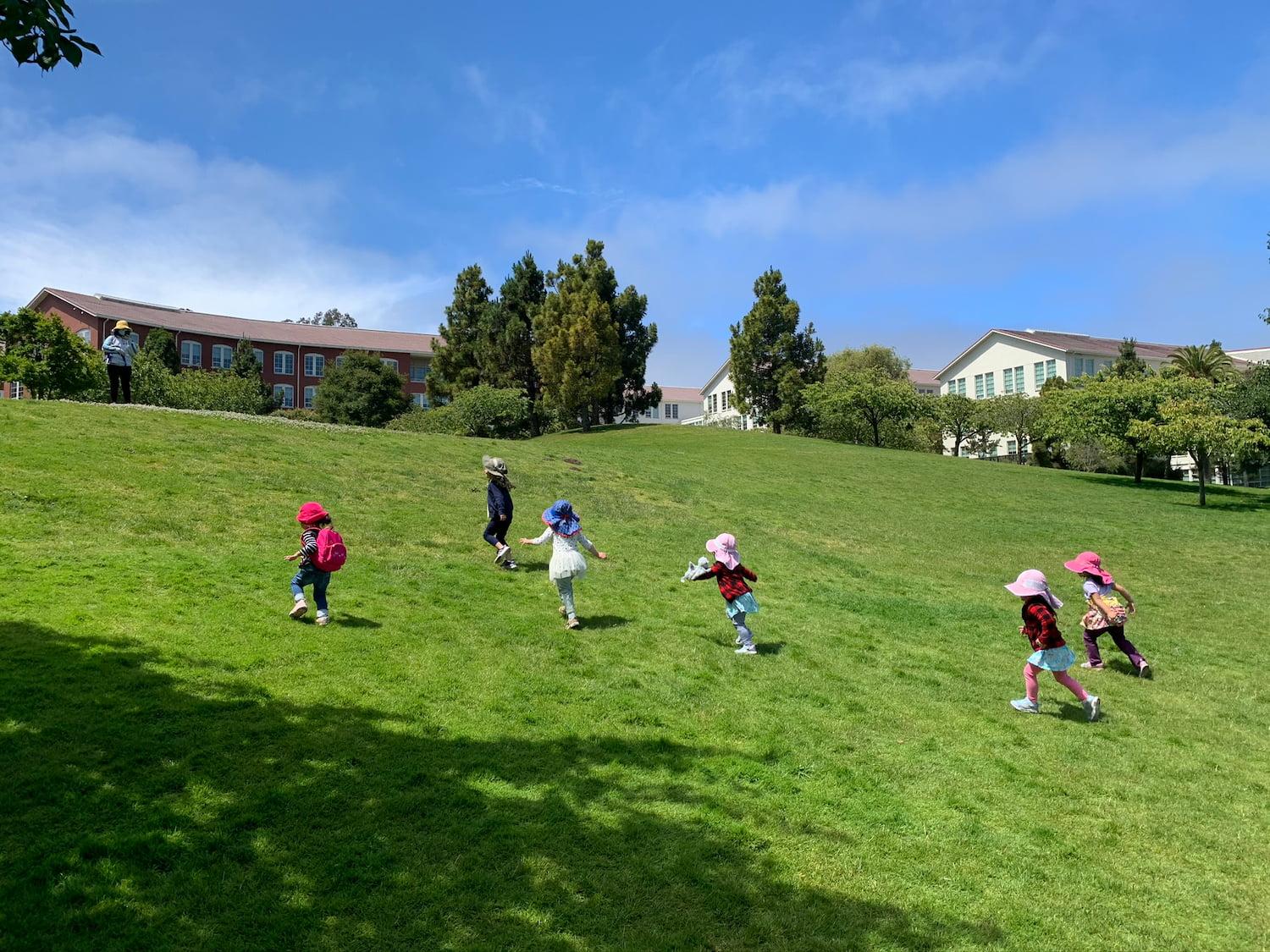 Children playing on the public lawn at the Letterman Digital Arts Center.