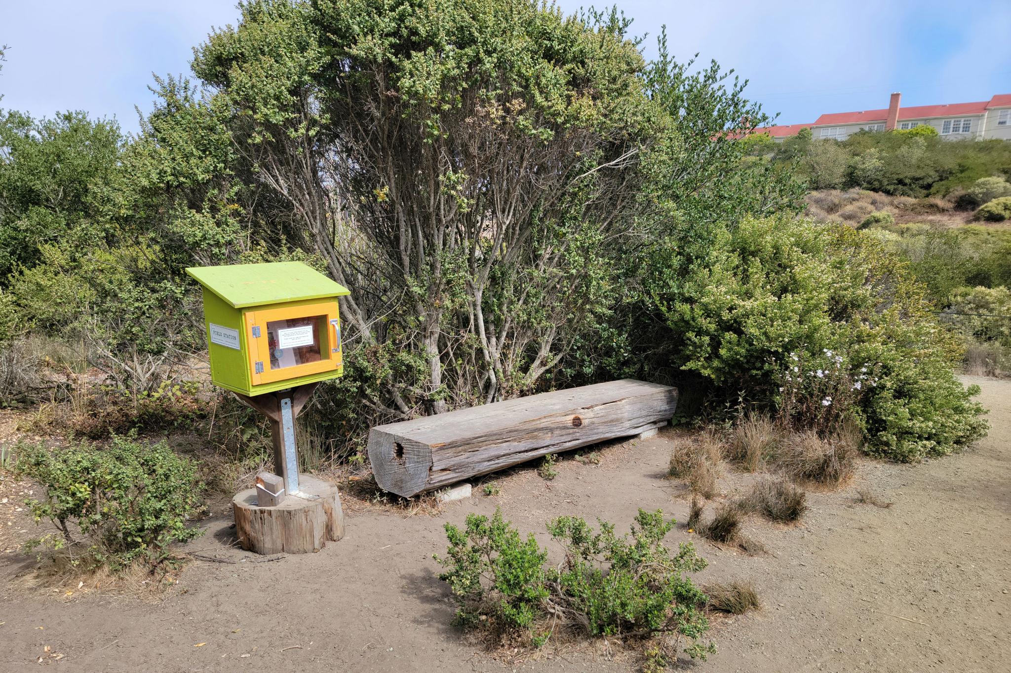A ”book nook” with tools to experience nature at El Polin Spring, located next to a bench.