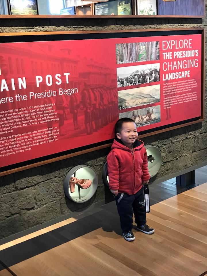 A young boy looking at exhibits at Presidio Visitor Center.