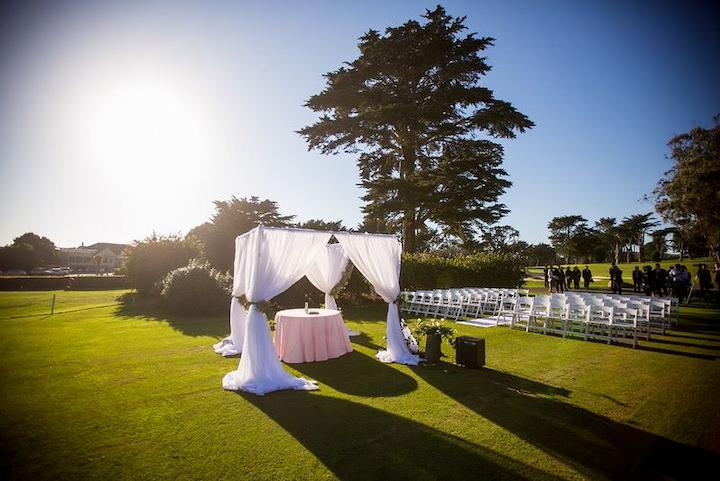 Lawn at Presidio Golf Course set with seating for a special event.