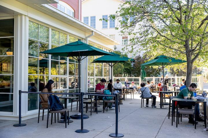 Customers enjoying the outdoor patio at Starbucks in the Presidio.