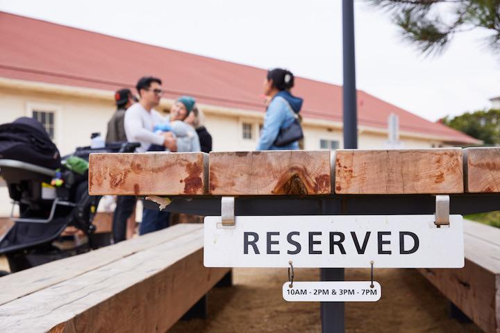 A “reserved” sign on a table at Picnic Place in the Presidio.