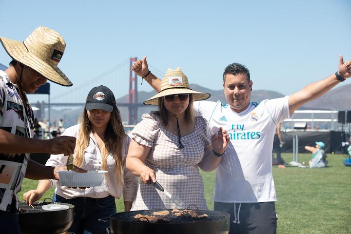Four people grilling at Picnic Place in the Presidio. Photo by Myleen Hollero.
