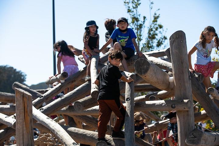Children play at the Outpost playground. Photo by Myleen Hollero.