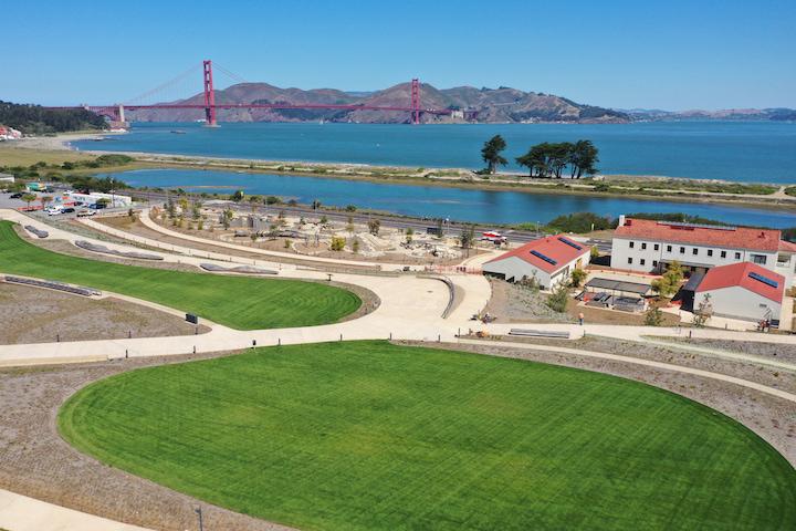 Two big lawns at Presidio Tunnel Tops, with the Golden Gate Bridge in the background. Photo by Plus M Productions.