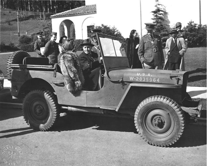 Jack Benny in front of Presidio Theatre in a jeep in 1942.