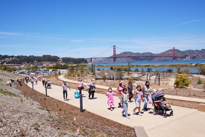 A group of people walking at Presidio Tunnel Tops, including a family with a stroller. Photo by Rachel Styer.