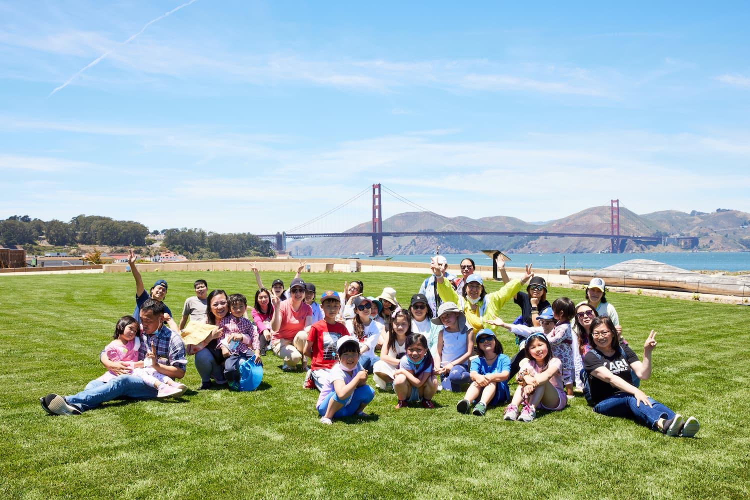 A group of kids on a lawn at Presidio Tunnel Tops. Photo by Rachel Styer.