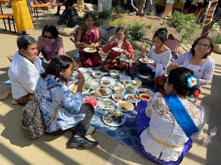 Participants share a meal at the Presidio's first Pchum Ben Festival.