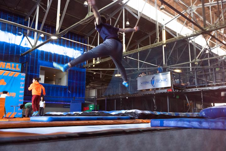 Person jumping on a trampoline at House of Air.