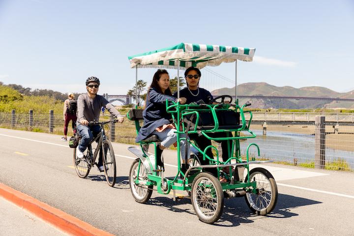 Visitors ride on a surrey at Crissy Field. Photo by Myleen Hollero.