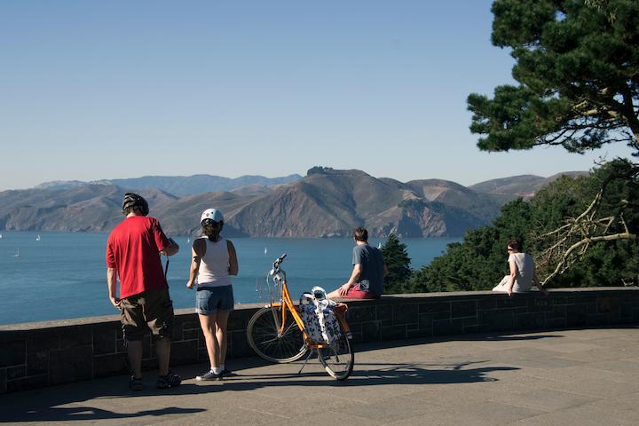 A group of visitors looks at the view from Immigrant Point Overlook.