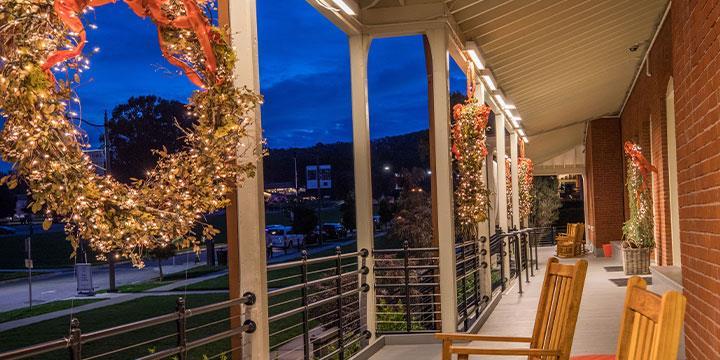 Lodge at the Presidio holiday decor on porch at night