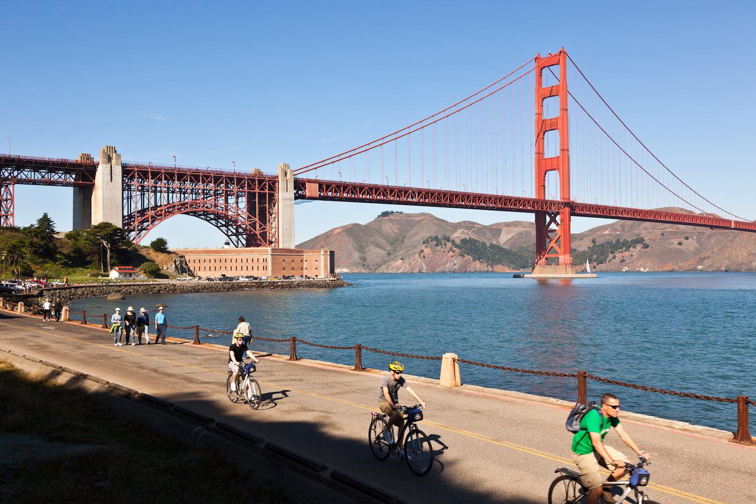 Several bicyclists on the Golden Gate Promenade/Bay Trail SF near Fort Point.