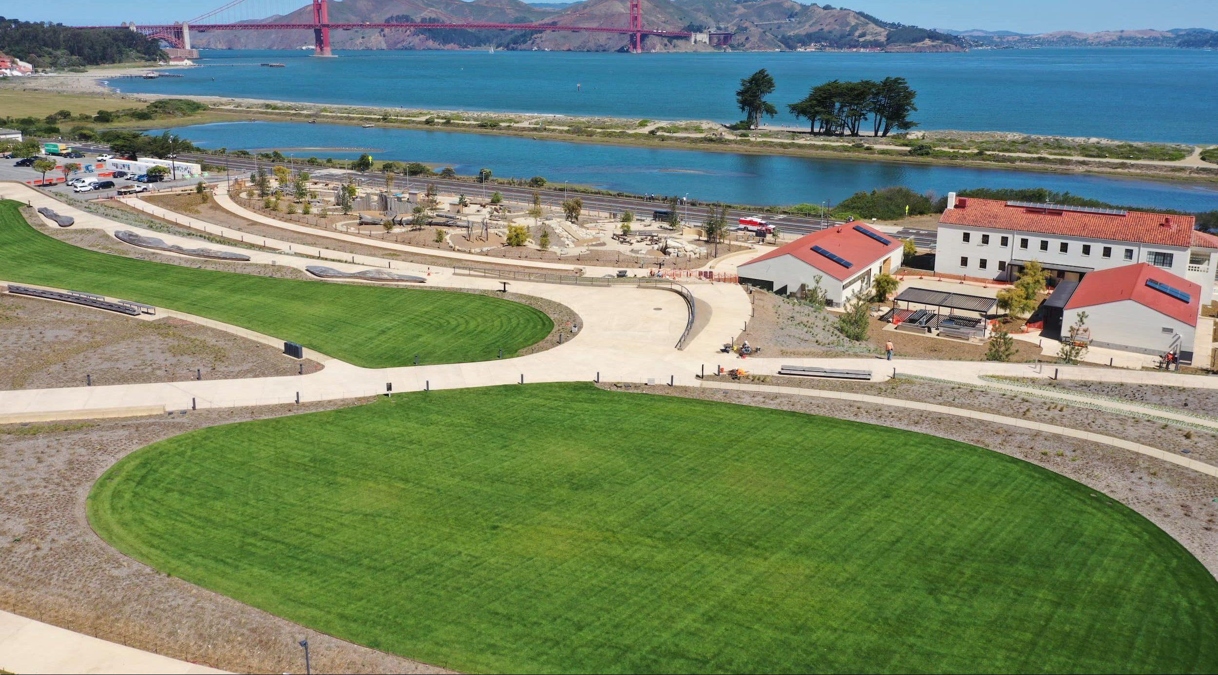 Two lawns at Presidio Tunnel Tops with the Golden Gate Bridge in the background. Photo by Plus M.