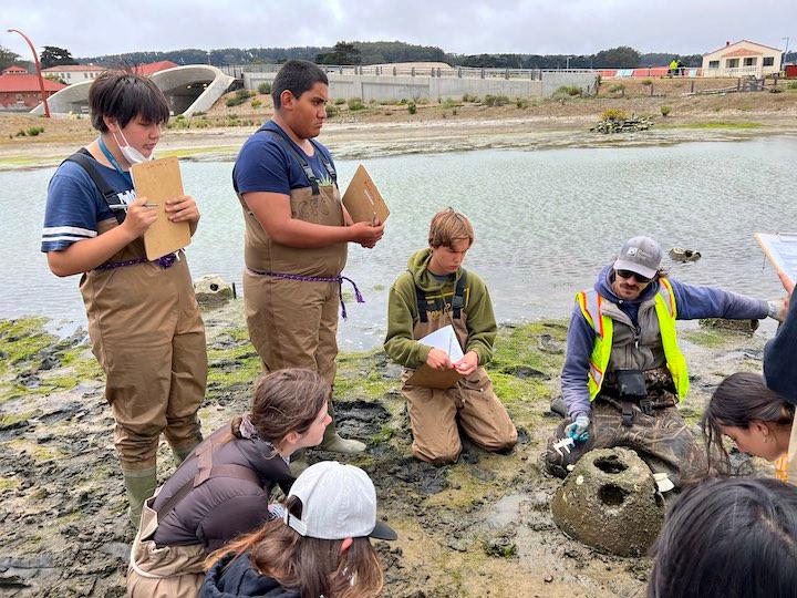 Students monitoring oyster restoration at Quartermaster Reach Marsh.