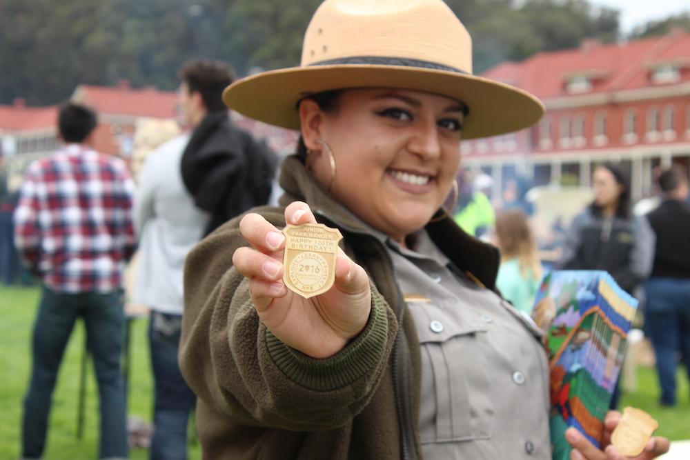 National Park Service ranger showing their badge.