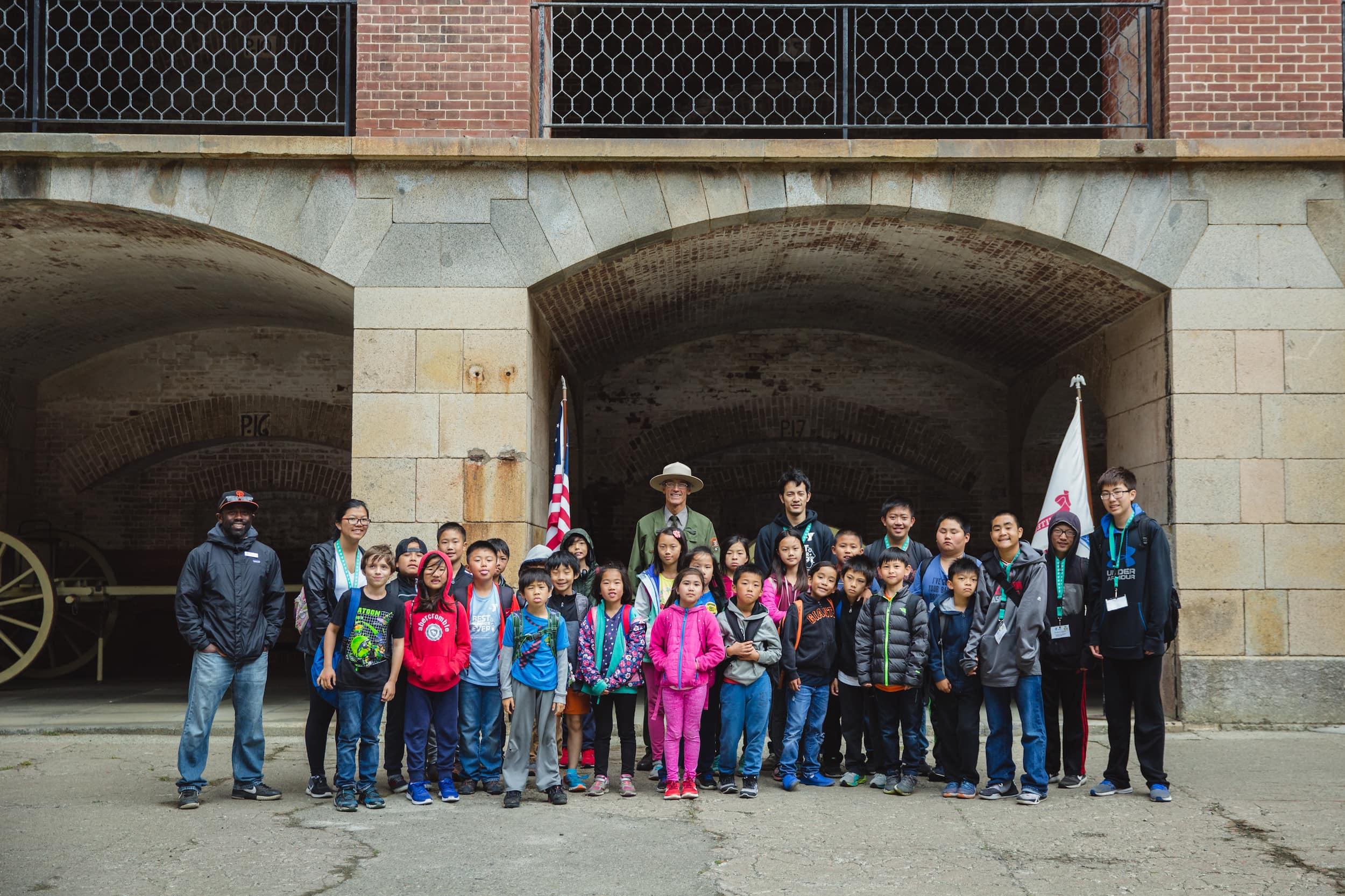 Park Ranger with a large group of kids at Fort Point. Photo by Erin Conger.