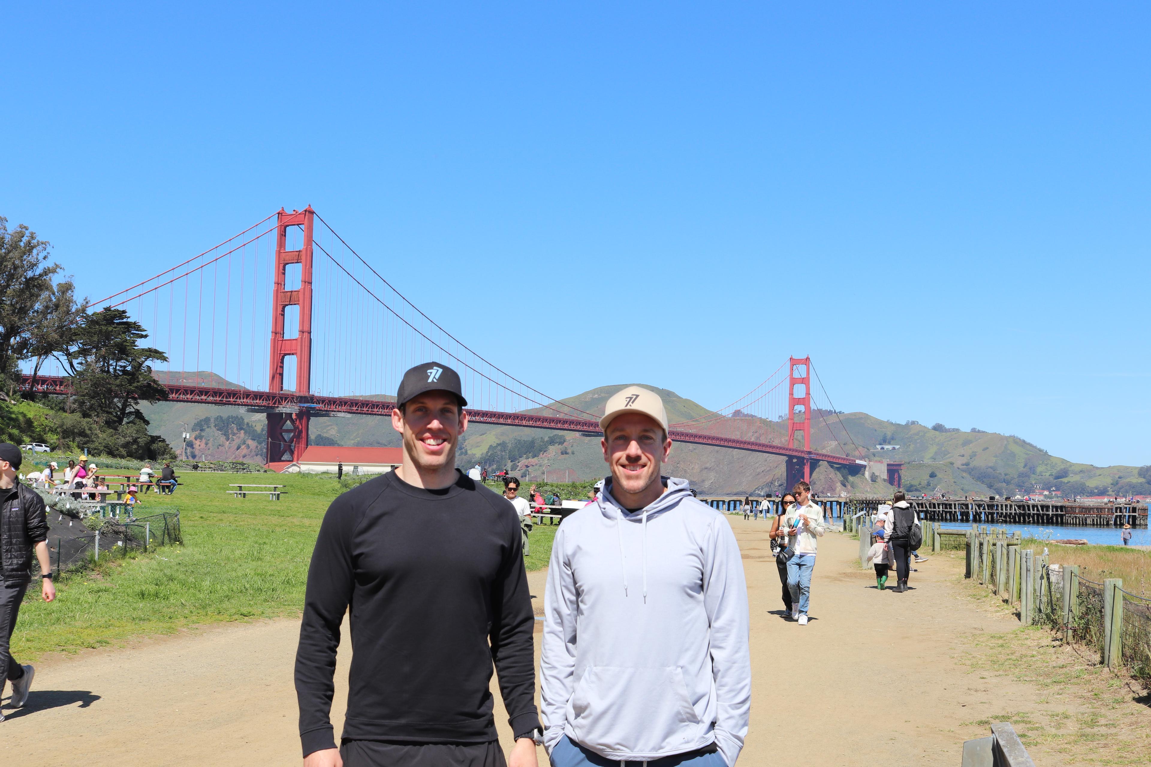 Two men in hats with the Golden Gate Bridge in the background